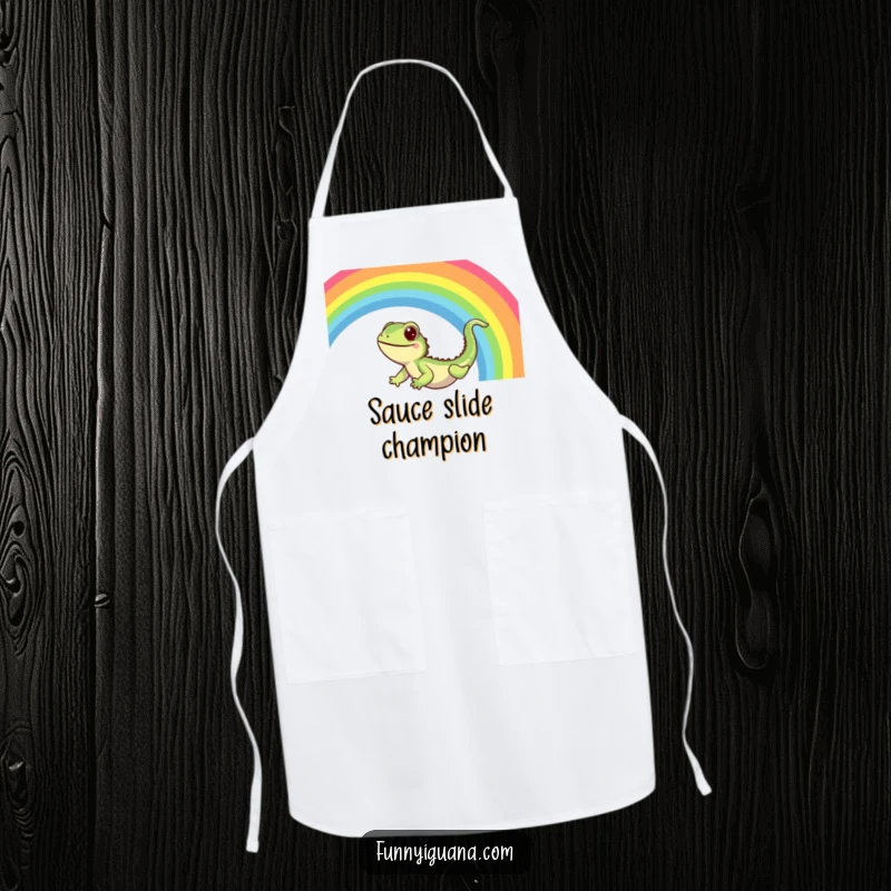 Funny Kawaii Iguana Apron: kitchen apron with a cute iguana sliding down a vibrant rainbow with pure delight, adding joy to cooking.